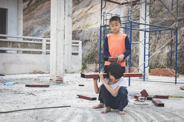 Fototapeta na wymiar Children working at construction site for world day against child labour concept: