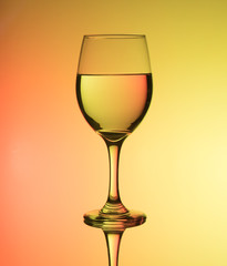 creative wine glass photography with yellow background