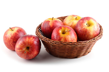 Gala apples on wicker plate