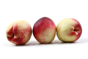 Three wet nectarines