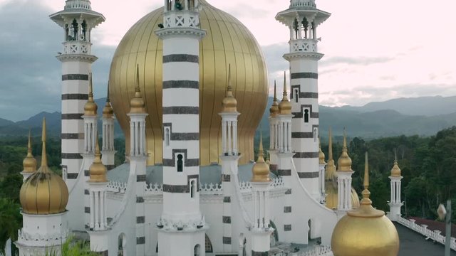 Aerial close up view of the beautiful Ubudiah Mosque, Kuala Kangsar, Perak, Malaysia at sunrise.