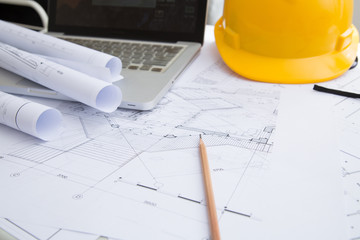 Yellow hard hat tools and drawings