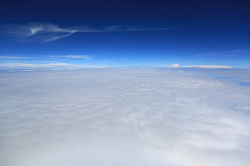 Puffy clouds seen from an airplane.