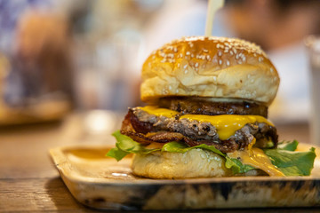 Close up beef hamberger on the wooden plate.