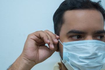 man is To wear the mask for protect himself from covid19 virus when his at the home during his...