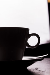 cup of coffee on wooden table
