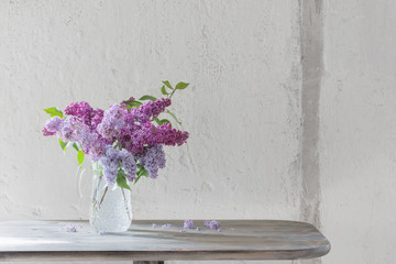 bouquet of lilacs in a glass jug