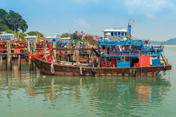 Many Fishing trawler are moored in the harbor of the small town Pekan Pangkor on the island of...