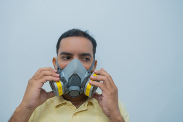 Young man with a protective mask against the coronavirus. The concept of health care and air pollution