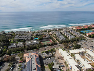 Fototapeta premium Aerial view of condo community next to the beach and sea in south california. Solana Beach. USA