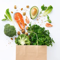 Foto auf Acrylglas Essen Shopping bag with healthy food on white background with copy space top view