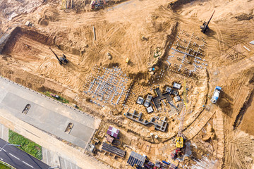 heavy industrial machinery working at construction site. building house foundations with pile...