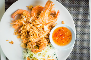 traditional Thai food-vegetables with omelet and fried shrimp with hot sauce