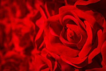 Artificial red rose background.