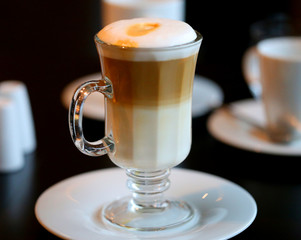 Photo of a large tasty cup of coffee with milk