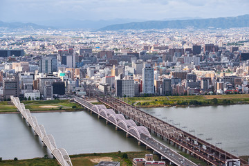 Fototapeta premium The birds eye view of Osaka city with Yodo River. Japan