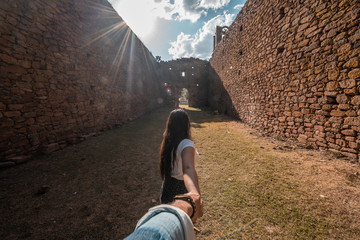 POV (Point of view) photograph of couple of tourist couple visiting a ruined church of a farm in...