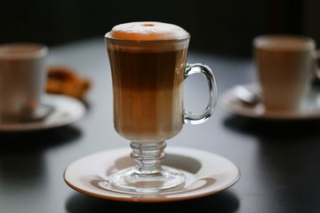 Photo of a large tasty cup of coffee with milk