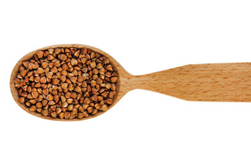 Buckwheat in a wooden spoon on a white background
