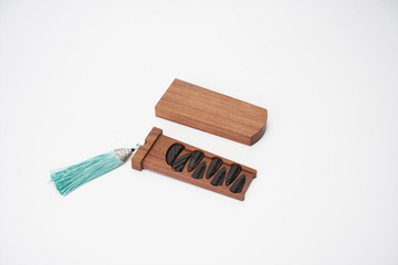 The ancient Chinese zither nails are in the white background