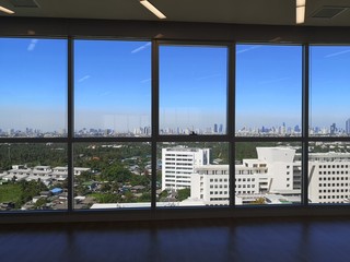 Plakat High building window looks to the background as the view of the building and the sky