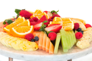 fruit platter with mixed variety of sliced fruits
