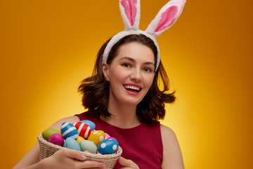 Young woman with colorful eggs