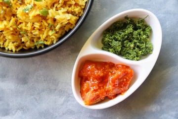 Indian comfort Food - Fresh Masala peanuts rice also known as Peanuts Pulav or rice khichdi. Garnished with coriander. Served hot with green chutney and mango pickle. with Copy space. 