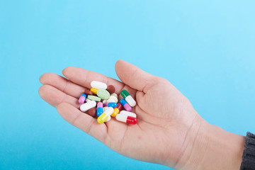 A bunch of capsules in the palm of your hand