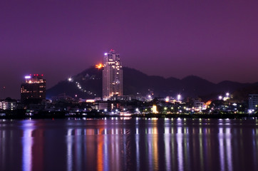 Fototapeta premium Colorful night view of Sriracha (Thailand) with modern city buildings