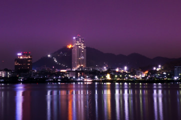 Colorful night view of Sriracha (Thailand) with modern city buildings