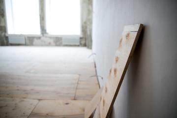 Empty room where there is a repair with tool and building material