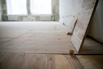 Empty room where there is a repair with tool and building material