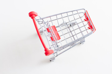 red mini cart for shopping on a white background