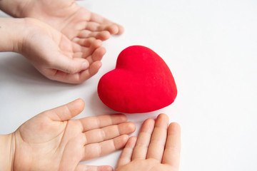 Child hands holding red heart, health care, donate and family insurance concept, world heart day, world health day, family love concept.