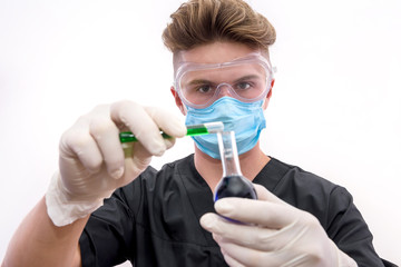 Chemist in protective uniform holding flask and test tube with minerals isolated on white. Science and experiment concept