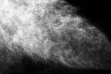 A stream of water and a cloud of drops