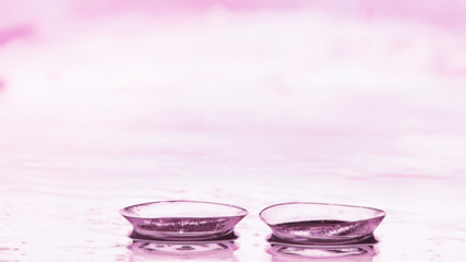 Tools for vision correction. Glasses and lenses with diopters on the background of splashes and...