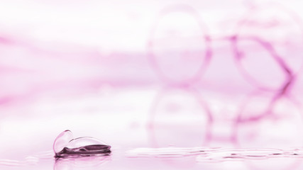 Tools for vision correction. Glasses and lenses with diopters on the background of splashes and...