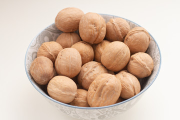 hole walnut in a bowl. Not open nuts in shell