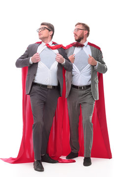 two businessmen in red capes standing in the pose of Superman