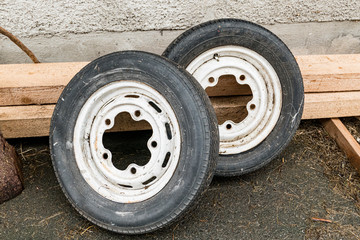 Old spare wheels of a car with white rims
