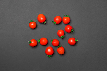 group of red tomato on black background