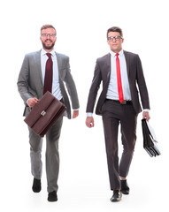 in full growth. smiling business partners walking together