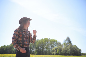 Cowboy with hat in a field in autumn