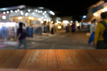 Empty dark wooden table in front of abstract blurred bokeh background of restaurant . can be used for display or montage your products.Mock up for space.