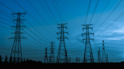 High voltage power tower and beautiful nature landscape at sunset