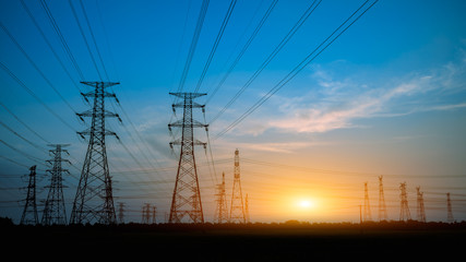 High voltage power tower and beautiful nature landscape at sunset