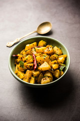 Kaccha Papita Sabji or Raw Papaya Sabzi, served in a karahi or bowl. selective focus