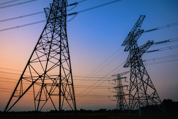 High voltage power tower and beautiful nature landscape at sunset